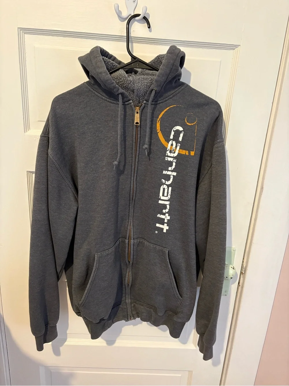 Carhartt Y2K Charcoal Gray Zip-Up Hoodie with Vertical Logo and Orange Accent.